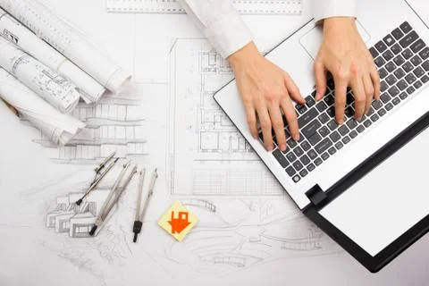 Architect working on blueprint. Architects workplace - architectural project Stock Photos
