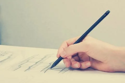 Architect working on blueprint. Architects workplace - architectural project Stock Photos