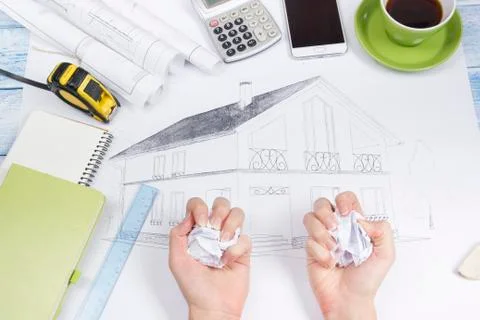 Architect working on blueprint. Architects workplace - architectural project Photos