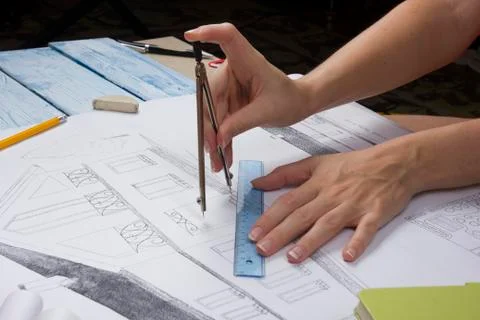 Architect working on blueprint. Architects workplace - architectural project Photos