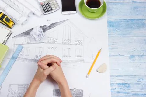 Architect working on blueprint. Architects workplace - architectural project Stock Photos