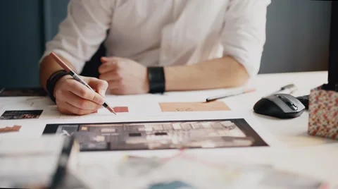 Architect working on blueprint close up Vídeos de archivo 56946788