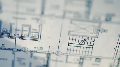 Architect working on blueprint close up Видео 72778465