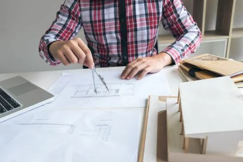 Architect working on blueprint, Engineer working with engineering tools for a Stock Photos