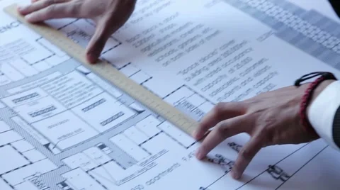Architect working with blueprint Stock Footage 42345597