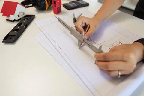 Architect working with blueprints, engineer inspection in workplace for Stock-Fotos
