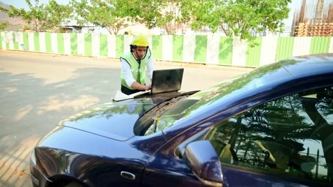 Architect working with computer outdoors Stock Footage 277036142