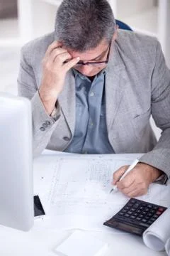 Architect working on construction blueprint in office Stock Photos