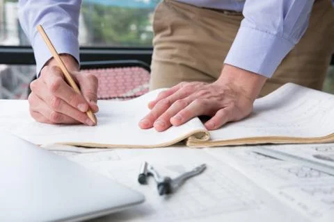 Architect working on construction plan at office. engineer inspect blueprint  Stock Photos