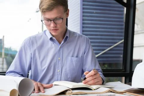Architect working on construction plan at office. engineer inspect blueprint  Stock Photos