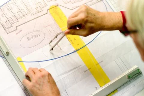 Architect working on drawing board Stock Photos
