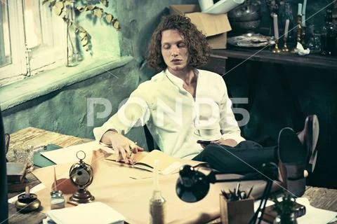 Architect working on drawing table in office Stock Photos