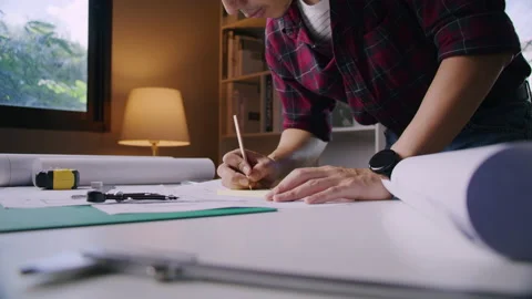 An architect is working in his home while covid-19 outbreak duration Stock Footage 170048475