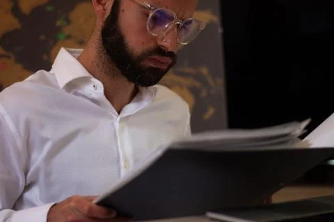 Architect working with his laptop while taking notes. Financial concept Stock Photos