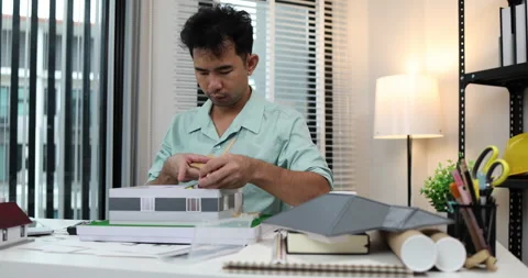 An architect is working in his office Stock-Footage 342242983