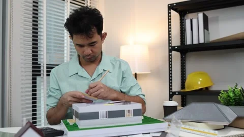 An architect is working in his office Stock-Footage 342243306