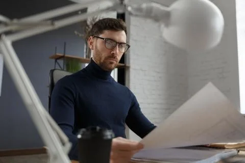 Architect working in office with blueprints.Engineer inspect architectural plan Stock Photos