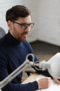 Architect working in office with blueprints.Engineer inspect architectural plan Stock Photos