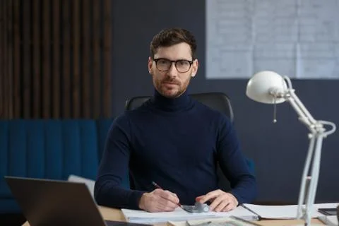 Architect working in office with blueprints.Engineer inspect architectural plan Stock Photos