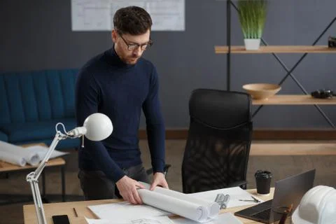 Architect working in office with blueprints.Engineer inspect architectural plan Foto stock