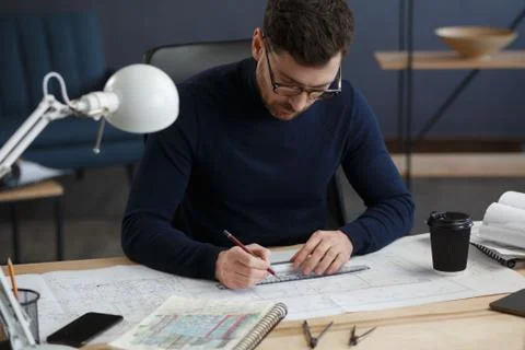 Architect working in office with blueprints.Engineer inspect architectural plan Foto stock