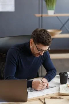 Architect working in office with blueprints.Engineer inspect architectural plan Stock Photos