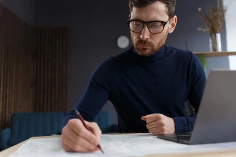 Architect working in office with blueprints.Engineer inspect architectural plan Stock Photos