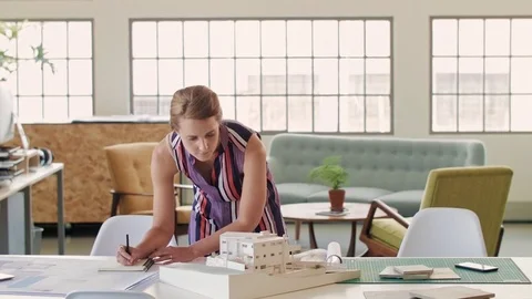 Architect working over architectural model Stock Footage 71632884