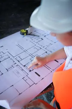 Architect working over plan. Closeup Desk With blueprints drawing. Stock Photos