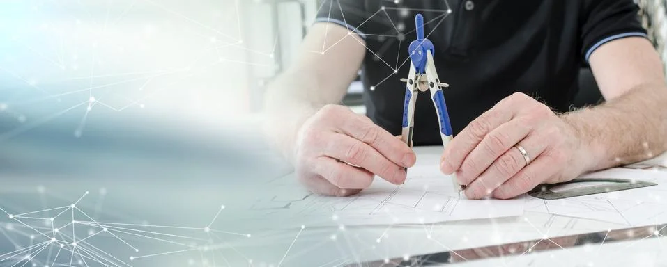 Architect working on plans; light effect 스톡 사진