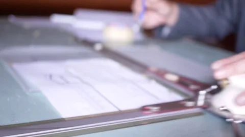 Architect Working on Plans with Old-fashioned Drawing Board Stock Footage 78920991