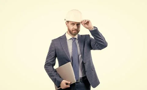 Architect working on project. chief engineer in hardhat hold computer. mature Stock Photos