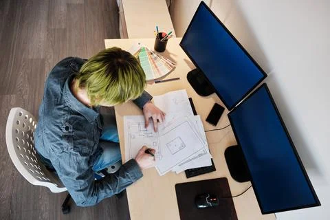 Architect Working On Project In Office. Architect working with blueprints. Yo Stock Photos