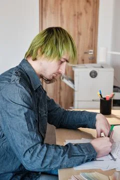 Architect Working On Project In Office. Architect designing house for client. Stock Photos