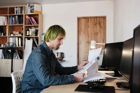 Architect Working On Project In Office. Architect working with blueprints. Stock Photos