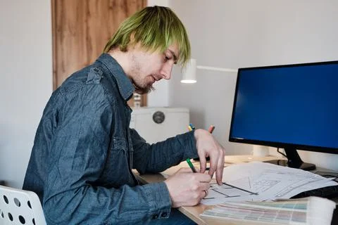 Architect Working On Project In Office. Architect designing house for client. Stock Photos