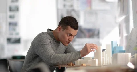 Architect working on scale model Stock Footage 86799084