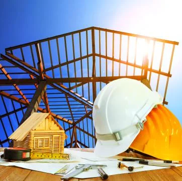 Architect working table hard hat house model plan sheet and writing equipment Stock-Fotos