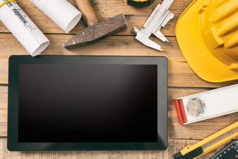 Architect workplace and technology. Tablet with black blank screen, project c 写真素材