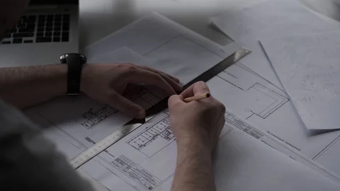 Architect works with documents and blueprint. male hands closeup. Stock Footage 108616382
