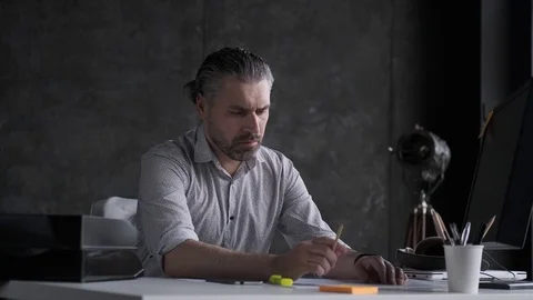 Architect works with documents and drawings in the office. Stock Footage 107769071