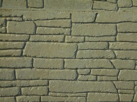 Architectonic pattern with irregular stone bricks. Stock Photos
