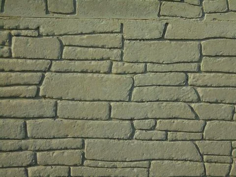 Architectonic pattern with irregular stone bricks. Stock Photos
