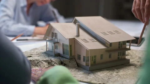 Architects and designers working on design of house layout in creative office Stock Footage 164989547
