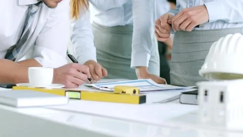 Architects and engineers team are working together to edit the draft building Video stock 336575363