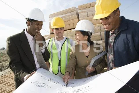 Architects And Workers Discussing At Site