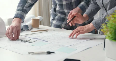 Architects are working on a building construction sketches design project.  Stock Footage 156468950
