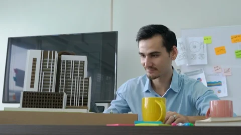 Architects are working on a building model. Stock Footage 93740330