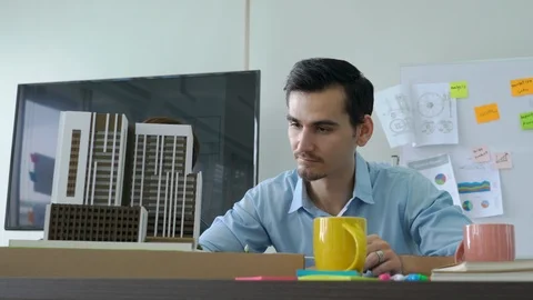 Architects are working on a building model. Stock Footage 93740789