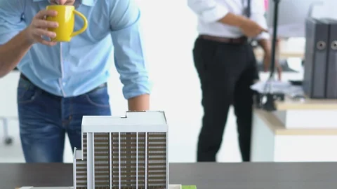 Architects are working on a building model at modern office. Stock Footage 106669408